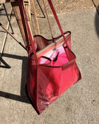 Elms+King Zanzibar Bag Wine Colour hanging on chair